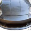 2003-2008 Nissan 350Z Duraflex V-Speed Body Kit - 4 Piece - Includes V-peed Front Bumper Cover (105646) V-Speed Side Skirts Rocker Panels (105647) V-Speed Rear Bumper Cover (105648)