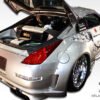 2003-2008 Nissan 350Z Duraflex Vader 3 Body Kit - 4 Piece - Includes Vader 3 Wide Body Front Bumper Cover (102263) Vader 3 Wide Body Rear Bumper Cover (102265) Vader 3 Wide Body Side Skirts Rocker Panels (102264)