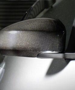 Add an exotic, race-inspired look to your vehicle without having to spend exotic money.  Featuring wide-angled, anti-glare lenses, these Carbon Fiber Mirror Covers w/ Lenses attach directly to your vehicle's factory mirrors quickly and easily.  No permanent modifications are necessary.Sold as a set - includes coverage of driver & passenger sides for one (1) vehicle.Features:Pre-preg. Carbon Fiber Manufacturing Process
Mirror Covers are vacuum-bagged and cured in the autoclave at high temperatures, ensuring quality, durability, and extremely-high strengh-to-weight ratios.
Fade-Resistant Clear Coat
Mirror Covers are finished with UV-stable, production clear coat paint, then individually hand-polished to a brilliant shine.
Easy Installation
Mirrors / Mirror Covers are designed to factory specifications for easy installation and clean fit and finish.