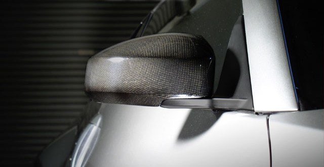 Add an exotic, race-inspired look to your vehicle without having to spend exotic money.  Featuring wide-angled, anti-glare lenses, these Carbon Fiber Mirror Covers w/ Lenses attach directly to your vehicle's factory mirrors quickly and easily.  No permanent modifications are necessary.Sold as a set - includes coverage of driver & passenger sides for one (1) vehicle.Features:Pre-preg. Carbon Fiber Manufacturing Process
Mirror Covers are vacuum-bagged and cured in the autoclave at high temperatures, ensuring quality, durability, and extremely-high strengh-to-weight ratios.
Fade-Resistant Clear Coat
Mirror Covers are finished with UV-stable, production clear coat paint, then individually hand-polished to a brilliant shine.
Easy Installation
Mirrors / Mirror Covers are designed to factory specifications for easy installation and clean fit and finish.