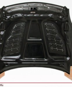 2003-2007 Infiniti G35 2Dr Z Speed Heat Extractor Carbon Fiber Hood. VIS Carbon Fiber Hoods and Trunks are made from 100% ISO-certified, Grade-A carbon fiber material.  All VIS Carbon Fiber Hoods and Trunks are manufactured using a two-part construction design.  The top layer is composed of carbon fiber material bonded to the hood surface with high-grade epoxy resin, andfinished with an ultra-clear (Poly Shield), UV-protective polyurethane coating for a high gloss finish.  A one-piece, smooth underside shell is fused to the top layer enhancing the product’s structural integrity.  The edges are smoothed by hands to insure good quality finish all around. In 2014, we further improved on this manufacturing process by introducing the Vacuum Infusion Process (V.I.P.), which utilizes a single-mold vacuum to produce parts that are 10-20% lighter than before while improving durability. We are transitioning our full spectrum of carbon parts to use the VIP process so that our customers can enjoy these improved products without incurring a huge cost increase.
All VIS Carbon Fiber Hoods and Trunks come with a VIS badge of authenticity. Please be sure to look for the badge when purchasing. Due to the unknown nature of the intended uses of these products, hood pins are required. These products are intended for off-road use only, unless your local and state laws state otherwise.